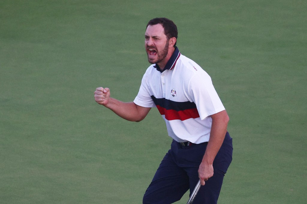 Team USA's Patrick Cantlay celebrates after holing his putt on the 18th hole during the Four-Balls.