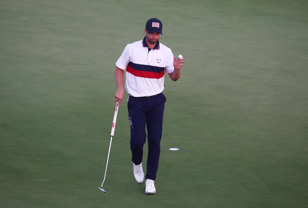 Team USA's Wyndham Clark reacts after holing his putt on the 18th hole during the Four-Balls.