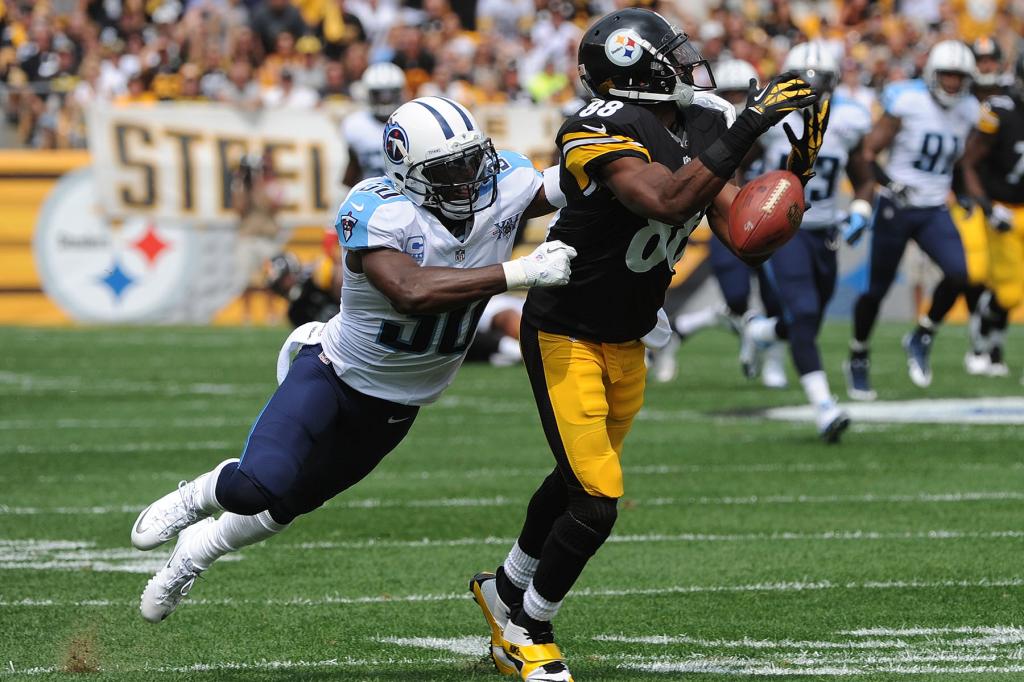 Cornerback Jason McCourty #30 of the Tennessee Titans defends on a pass intended for wide receiver Emmanuel Sanders #88 of the Pittsburgh Steelers during a game at Heinz Field on September 8, 2013 in Pittsburgh, Pennsylvania.  The Titans defeated the Steelers 16-9. 