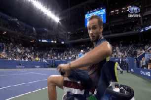 A frustrated Daniil Medvedev pushes away the camera before the fourth set of his second-round victory at the U.S. Open.