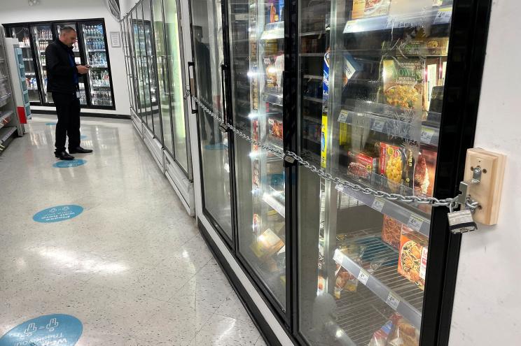 Freezer doors locked at a San Francisco grocery store due to shoplifting.