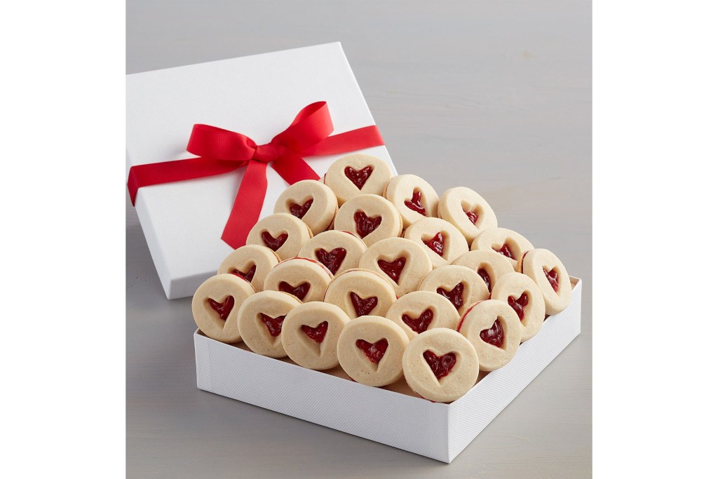 box of cookies with red jam inside