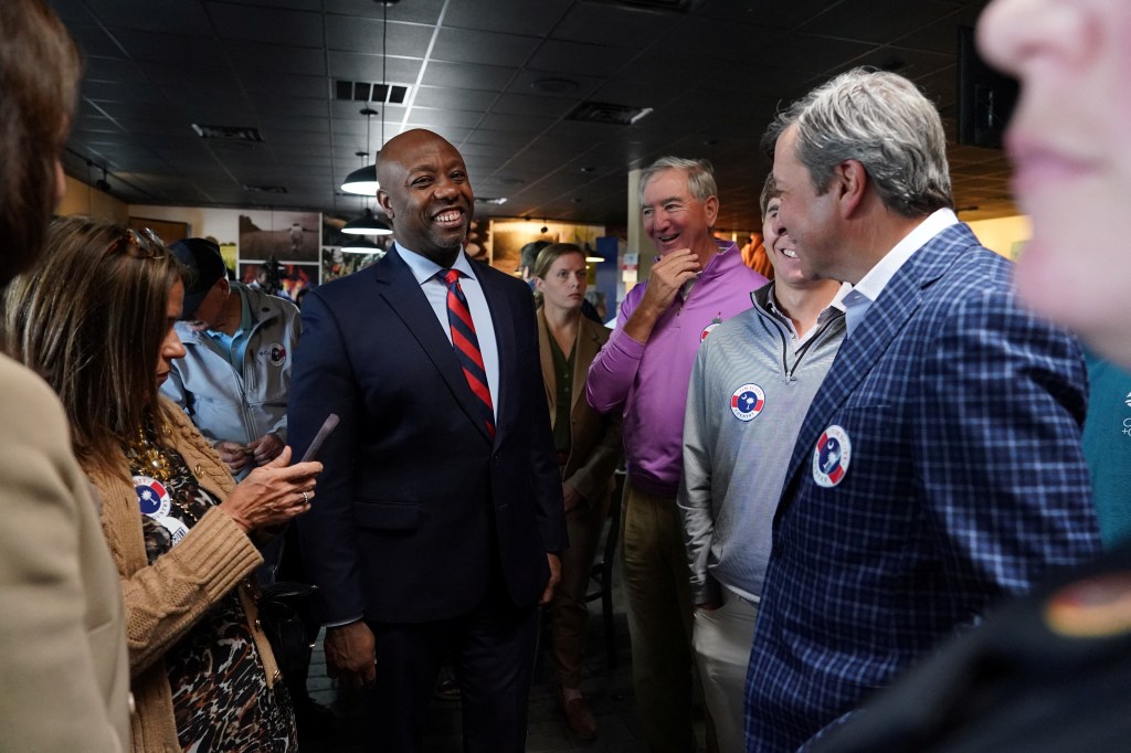 Tim Scott smiles and speaks to people after filing for the South Carolina 2024 Presidential Primary ballot in Columbia, South Carolina.