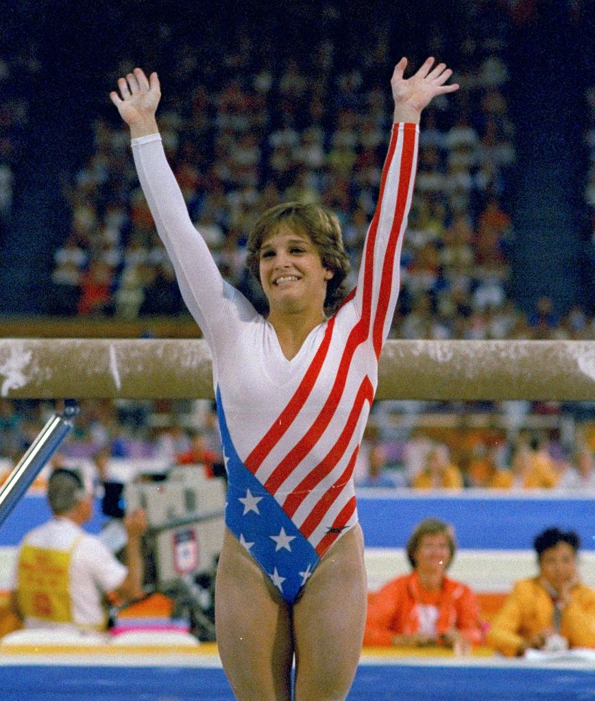 Mary Lou Retton reacts to applause after her performance at the Summer Olympics in Los Angeles on Aug. 3, 1984. 