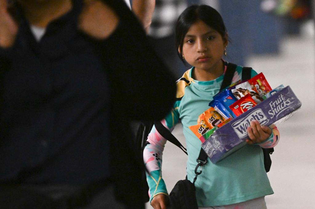 Young girl who exited the C train alone with candy on the Columbus Circle C train platform