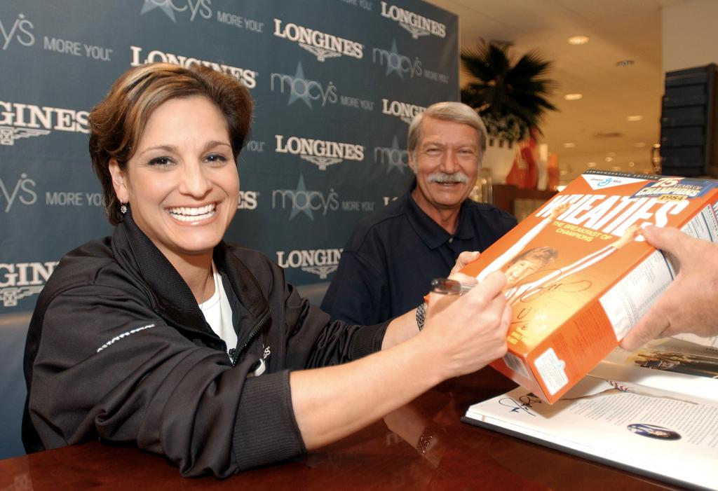 Mary Lou Retton signs a Wheaties box in 2003.