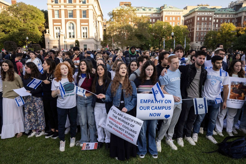 Pro-Israel demonstrators sing a song during a protest at Columbia University, Thursday, Oct. 12, 2023,