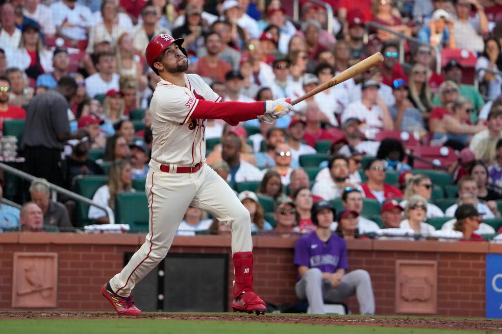 Dylan Carlson hits a sacrifice fly for the Cardinals.