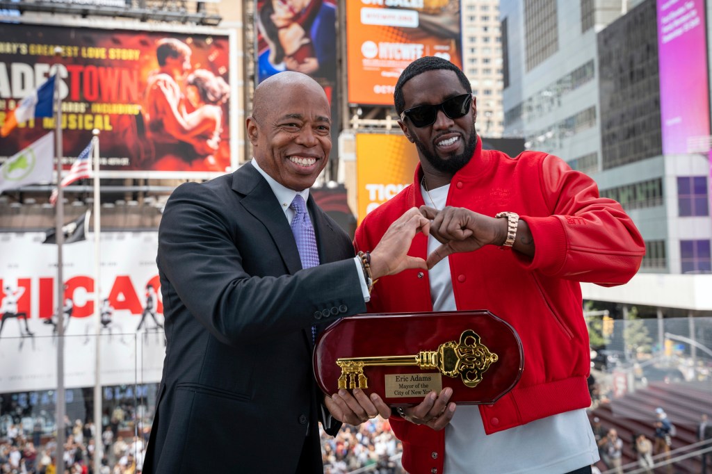 Adams and rap mogul Sean "Diddy" Combs made a hand heart together in Times Square on Sept. 15.