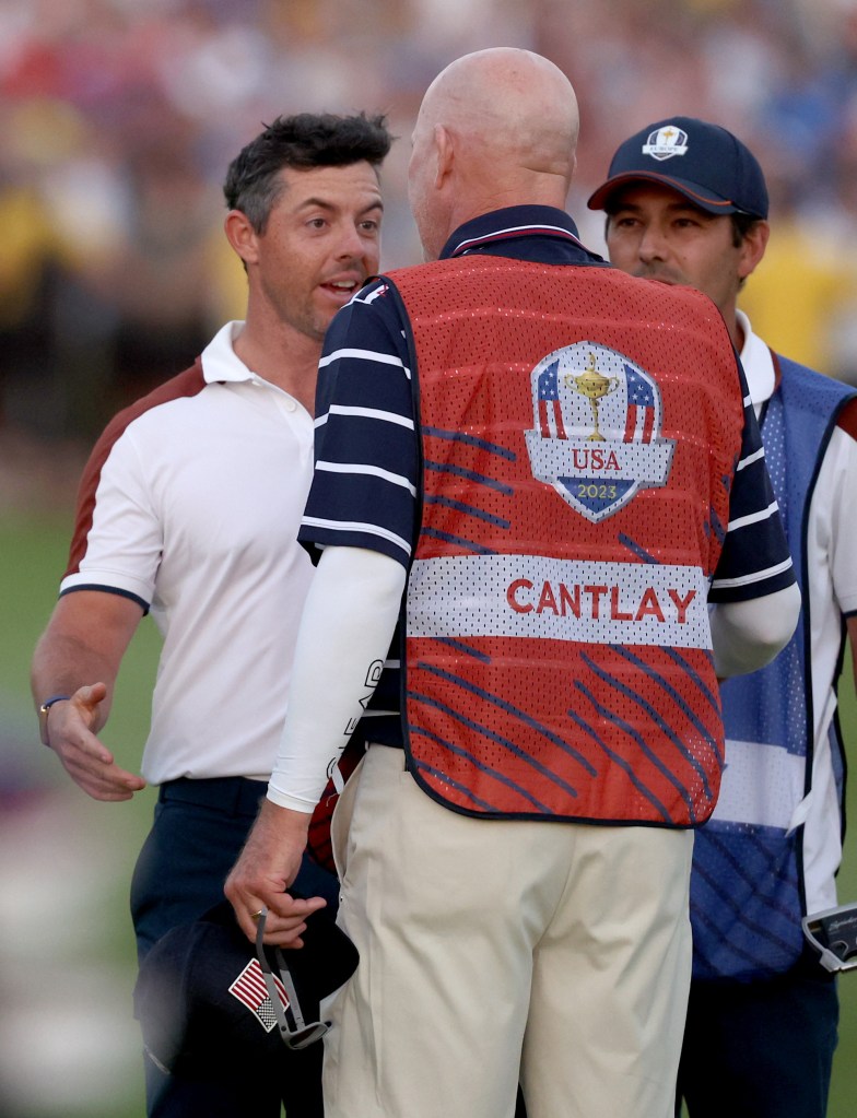 Rory McIlroy and Joe LaCava argue on the green at the Ryder Cup on Sept. 30, 2023.