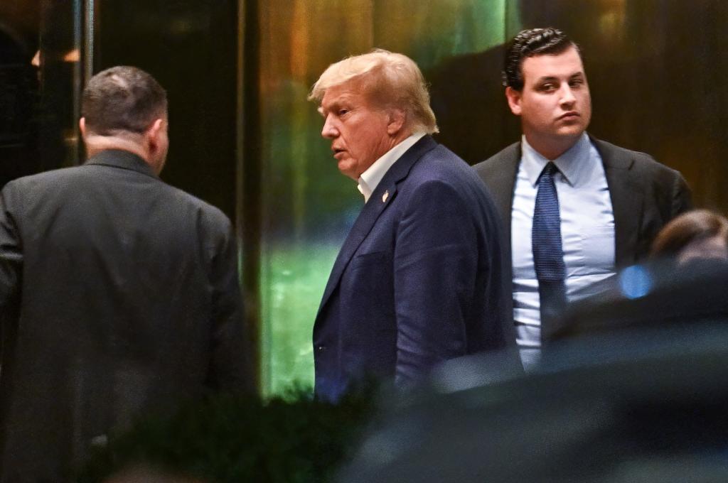 Former President Donald Trump is seen arriving at Trump Tower Sunday night.