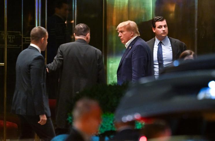 Former President Donald Trump is seen arriving at Trump Tower Sunday night.