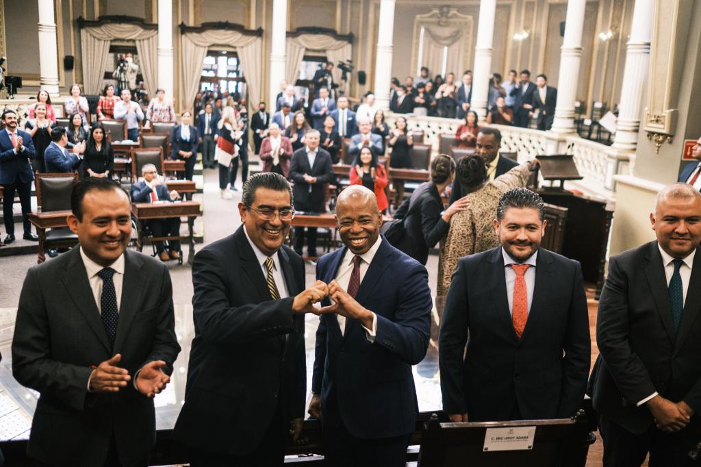 Governor of Puebla Sergio Salomon Cespedes and Adams make a heart with their hands during Adams' recent Mexico trip.