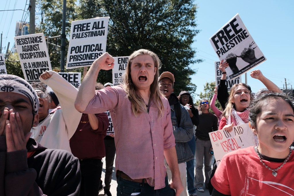 A group of pro-Palestine protesters gathered outside of the Israeli Consulate in Atlanta on Sunday.