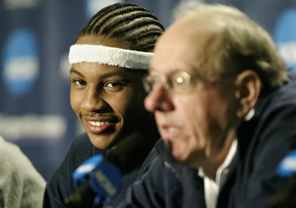 Carmelo Anthony looking at Jim Boeheim during a press conference.