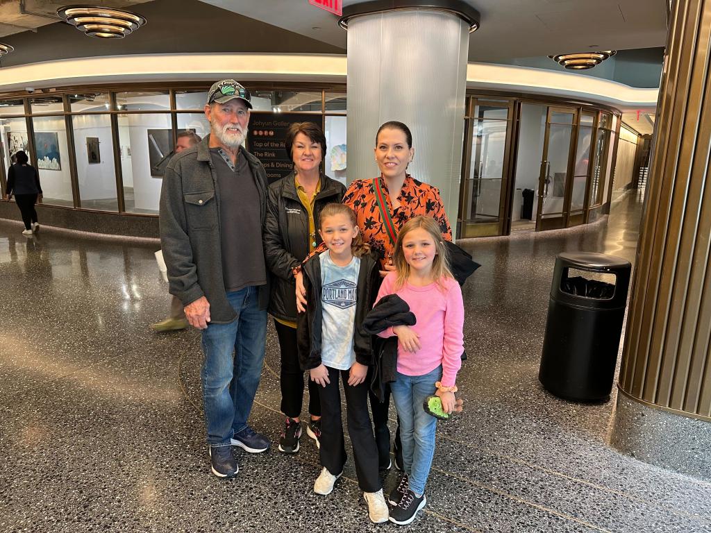 Amanda Jackson and family in Rockefeller Center concourse. 