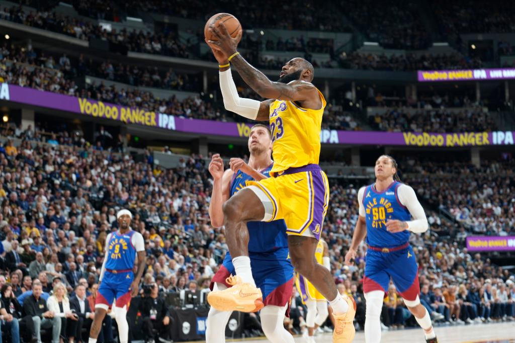 james shooting layup past defenders