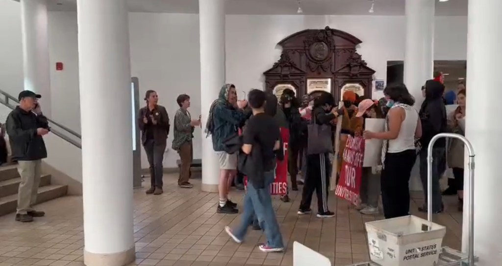 Protesters gather in the lobby.