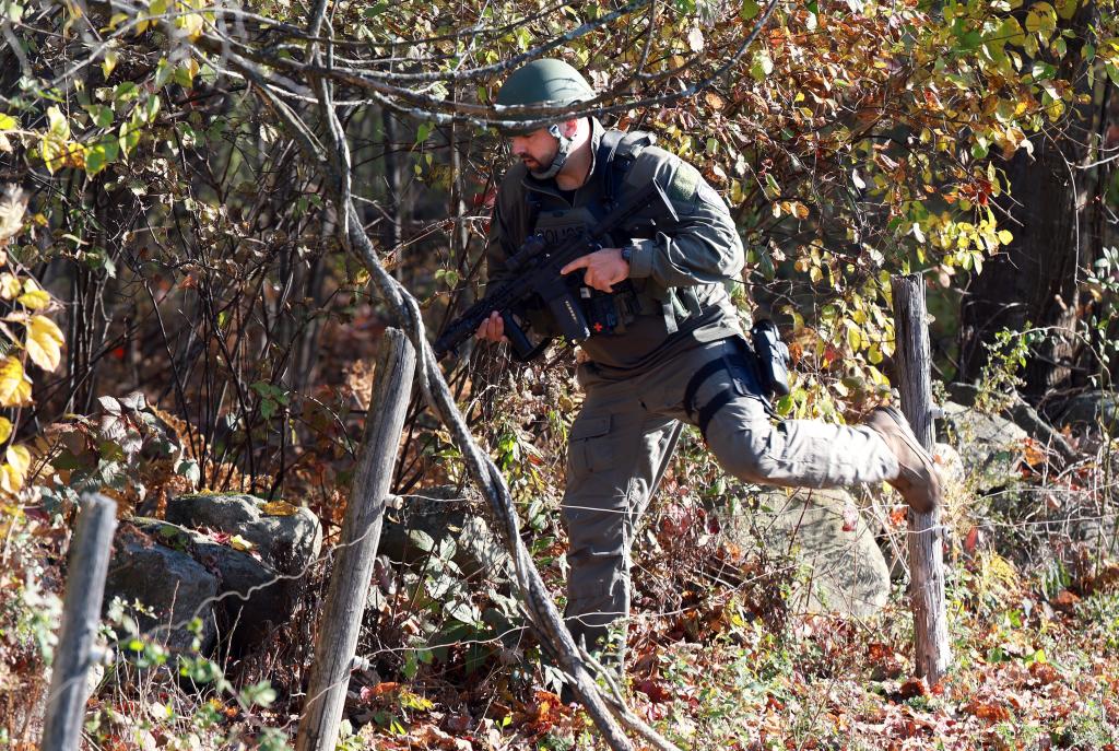 MONMOUTH, MAINE - OCTOBER 27: Law enforcement officials conduct a manhunt for suspect Robert Card following a mass shooting on October 27, 2023 in Monmouth, Maine. Police are actively searching for a suspect, Army reservist Robert Card, who allegedly killed 18 people in a mass shooting at a bowling alley and restaurant in Lewiston, Maine. (Photo by Joe Raedle/Getty Images)