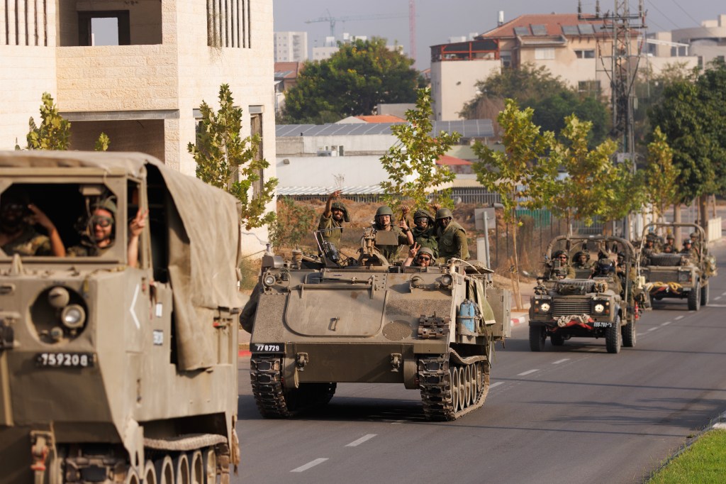 Israeli military vehicles heading towards the Gaza border on October 28, 2023.