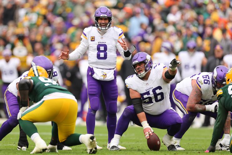 Kirk Cousins #8 of the Minnesota Vikings calls a play against the Green Bay Packers