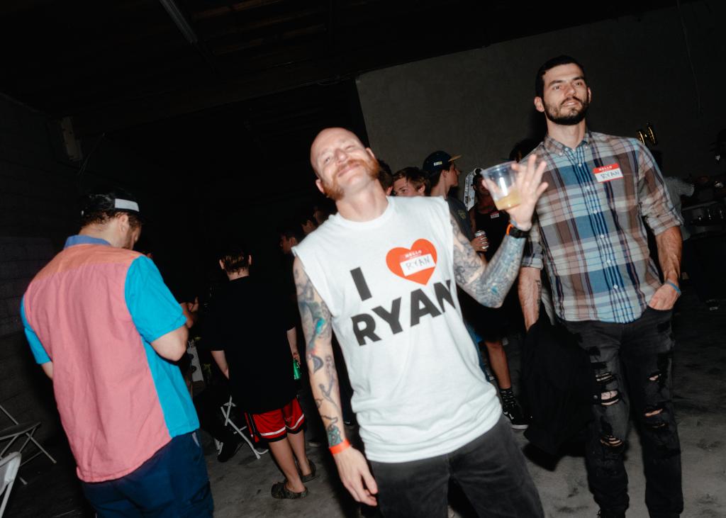 A man is seen wearing an "I heart Ryan" shirt.