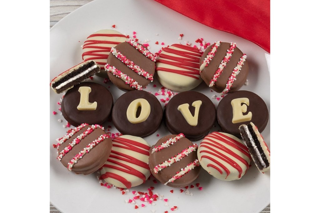 A plate of cookies with a red ribbon.