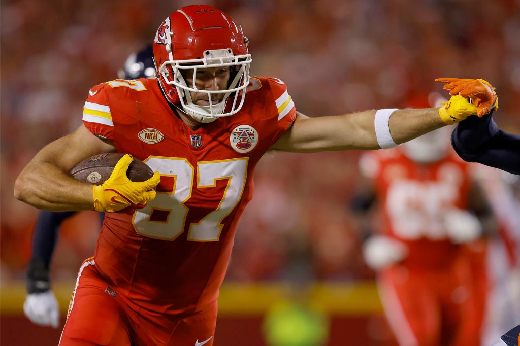 Travis Kelce runs with the ball during a Chiefs game on Oct. 12, 2023.