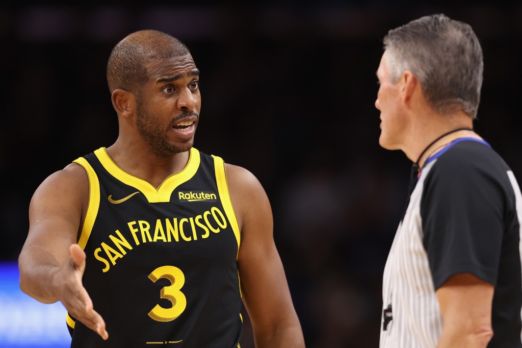 Chris Paul #3 of the Golden State Warriors reacts to referee Scott Foster #48 during the first half of the NBA game against the Phoenix Suns at Footprint Center on November 22, 2023 in Phoenix, Arizona. 