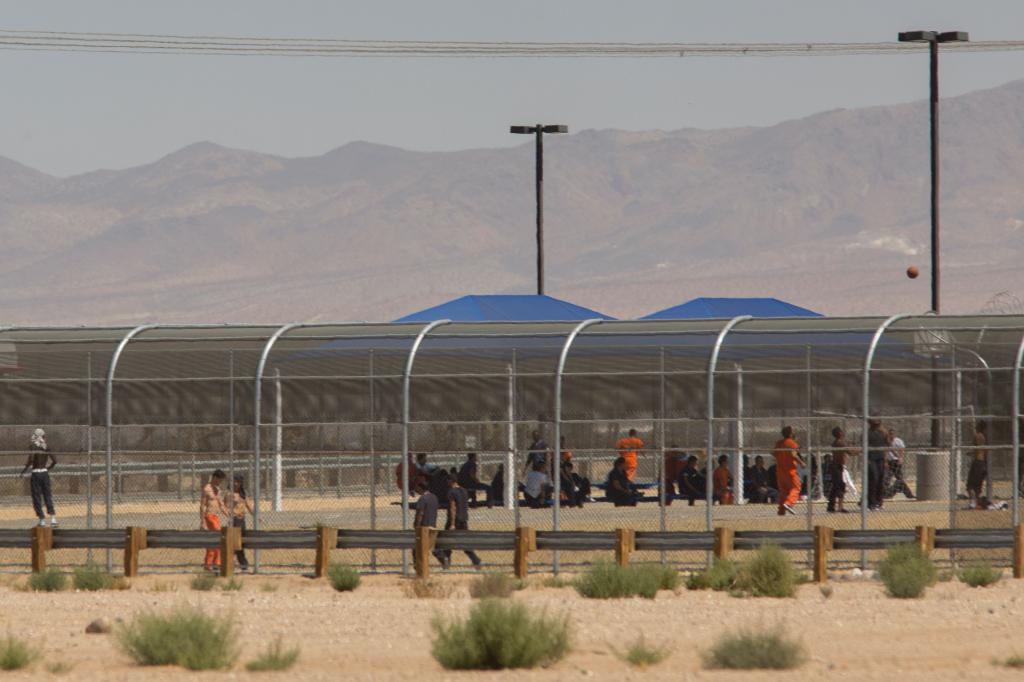 Imprisoned immigrants are seen at the US Immigration and Customs Enforcement (ICE) Adelanto Detention Facility near the border of the "green zone," an area designated by the city for the development of industrial scale marijuana cultivation, on September 6, 2016 in Adelanto, California. 