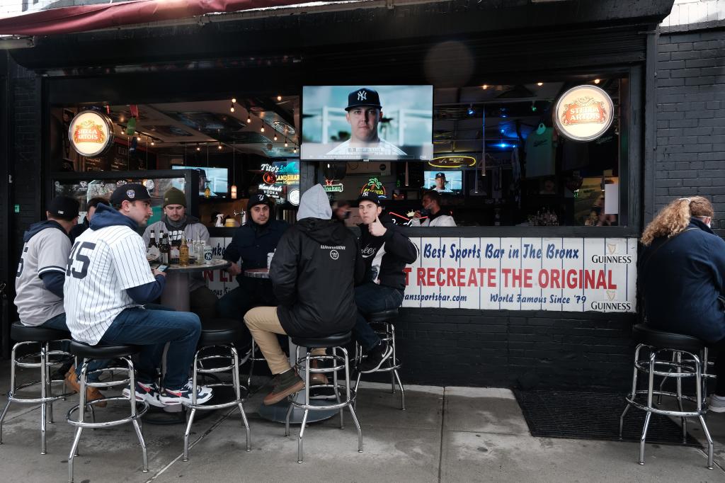 Yankees fans drink at a bar outside Yankee Stadium.