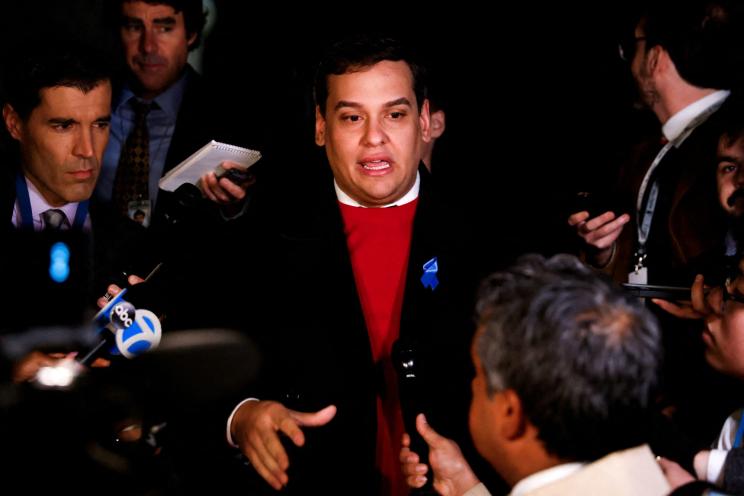 FILE PHOTO: U.S. Rep. George Santos (R-NY) speaks to members of the media after his congressional colleagues voted not to expel him from the House,