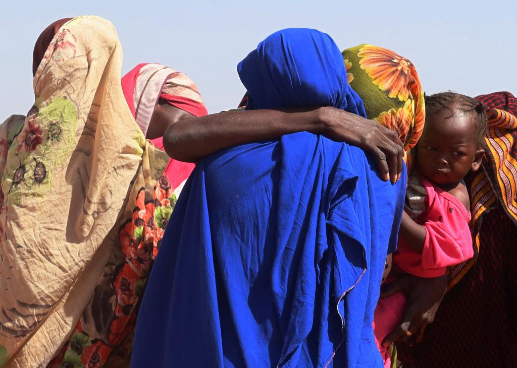 Women from El Geneina, West Darfur, weep after receiving news of their missing relatives in Ardamata, as they waited for them in Adre, Chad, November 7, 2023.