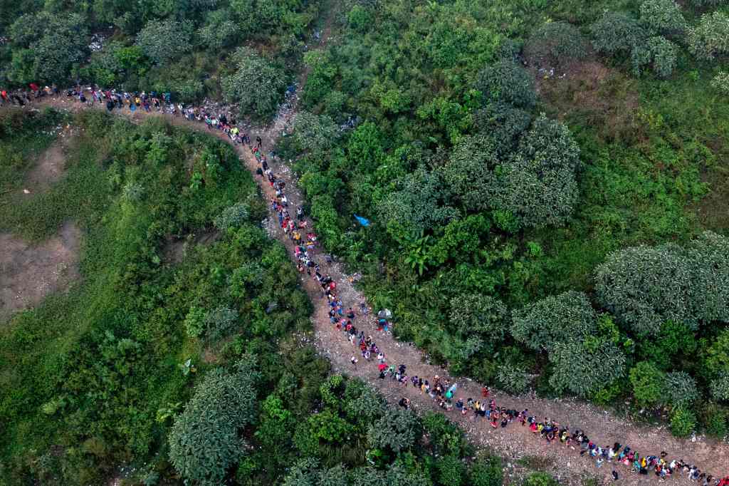 An aerial view of migrants walking 