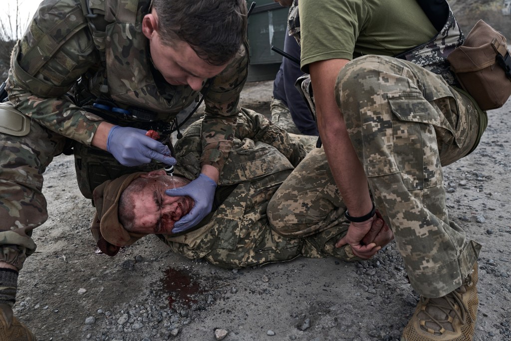 A wounded Ukrainian soldier is treated on November 1, 2023 in Kupiansk, Ukraine.