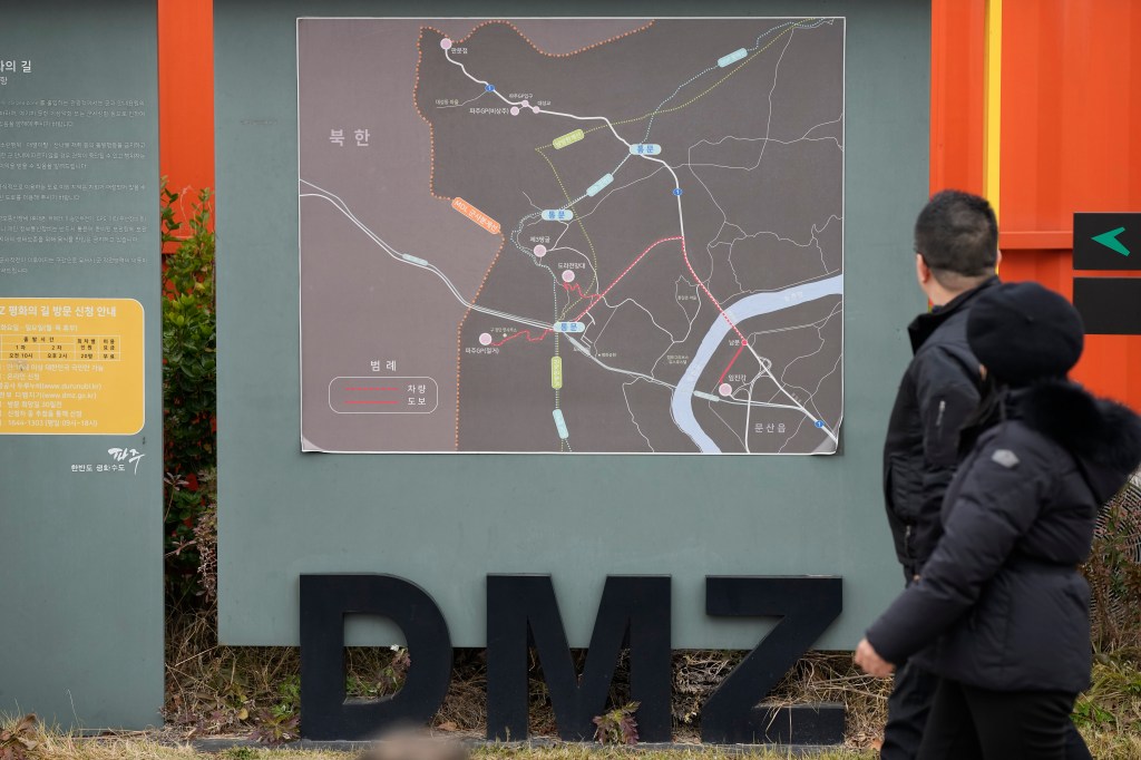 Visitors look at a map of the Demilitarized Zone Imjingak Pavilion in Paju, South Korea.