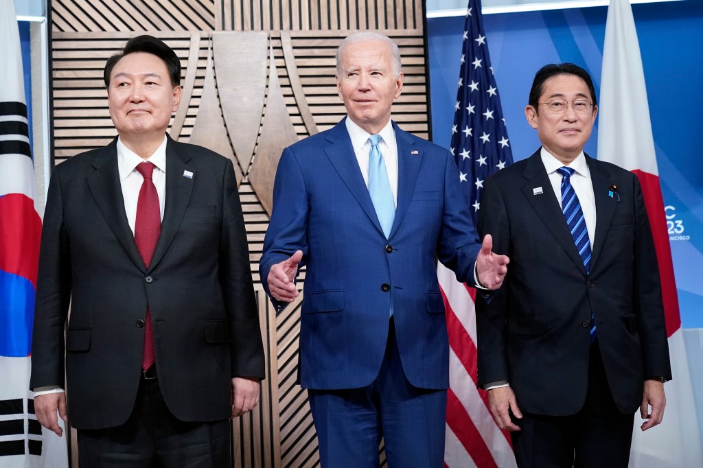 Japan's Prime Minister Kishida Fumio, President Joe Biden and South Korea's President Yoon Suk Yeol pose for a photo ahead of their meeting on the sidelines of the Asia-Pacific Economic Cooperation summit, Thursday, Nov. 16, 2023, in San Francisco. 