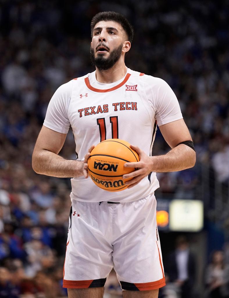 Fardaws Aimaq #11 of the Texas Tech Red Raiders shoots a free throw against the Kansas Jayhawks in the second half at Allen Fieldhouse on February 28, 2023 in Lawrence, Kansas.