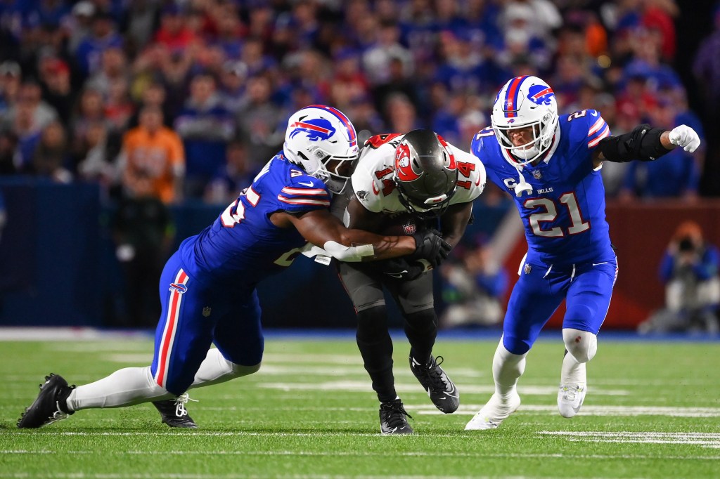 Buccaneers receiver Chris Godwin is taken down by Tyrel Dodson of the Bills on  Oct. 26, 2023.