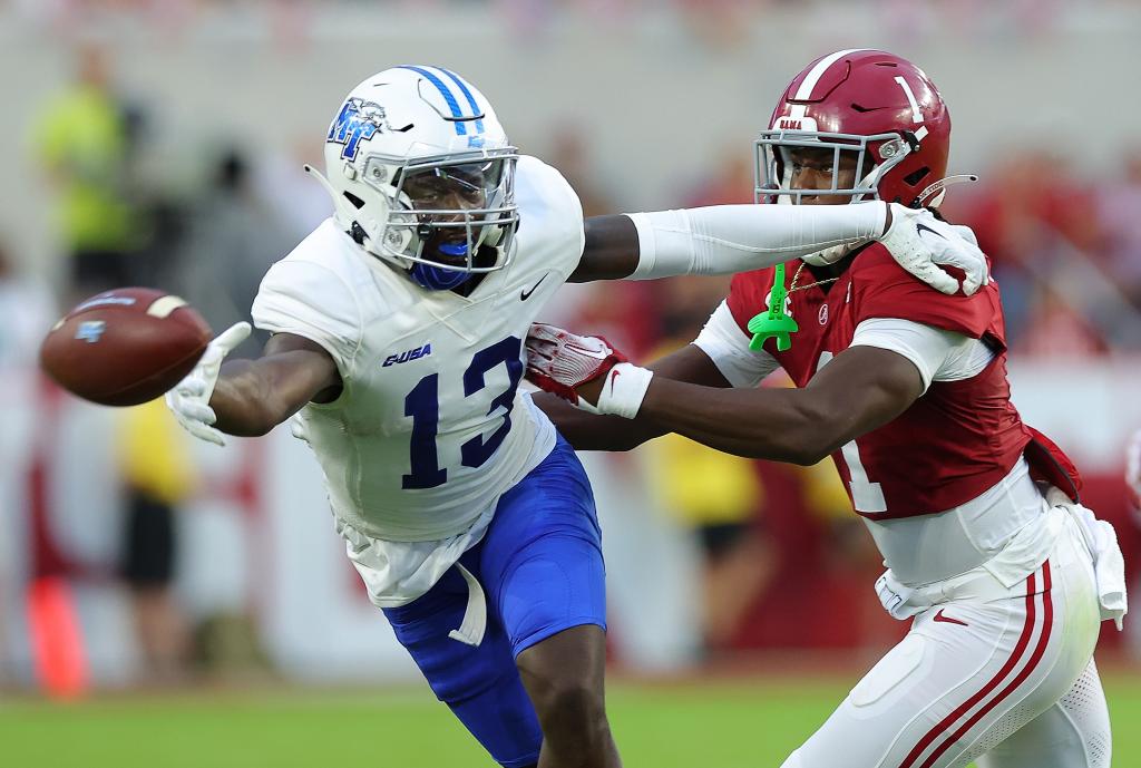 Javonte Sherman #13 of the Middle Tennessee Blue Raiders fails to pull in this reception against Kool-Aid McKinstry #1 of the Alabama Crimson Tide during the first quarter at Bryant-Denny Stadium on September 02, 2023 in Tuscaloosa, Alabama.