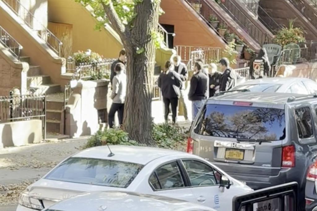 Federal agents outside Suggs' house. 