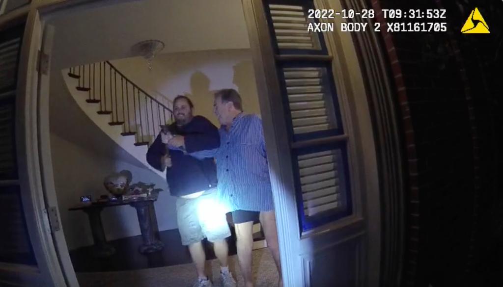 FILE - In this image taken from San Francisco Police Department body-camera video, the husband of former U.S. House Speaker Nancy Pelosi, Paul Pelosi, right, fights for control of a hammer with his assailant David DePape during a brutal attack in the couple's San Francisco home on Oct. 28, 2022. Opening statements are scheduled for Thursday, Nov. 8, 2023, in the federal trial of the man accused of breaking into former House Speaker Nancy Pelosi's San Francisco home seeking to kidnap her and bludgeoning her husband with a hammer.