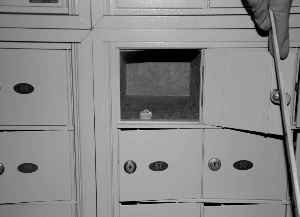 A small baggy containing roughly one gram of the white, powdery substance is visible in locker no. 50