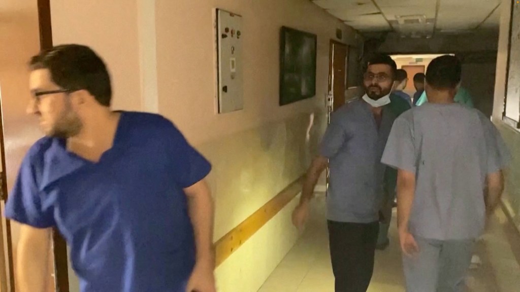 Palestinian medics are seen inside Al-Shifa hospital in Gaza during the Israeli raid.