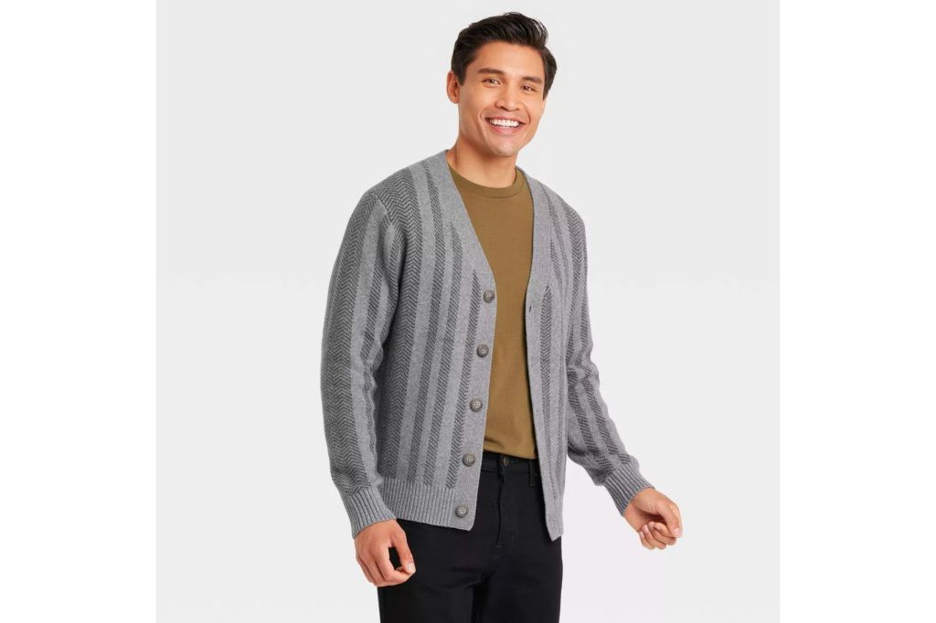 A man in a grey cardigan