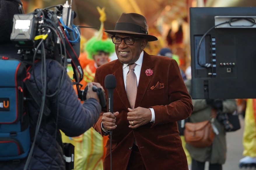 Al Roker presents along the Macy's Thanksgiving Day Parade route.