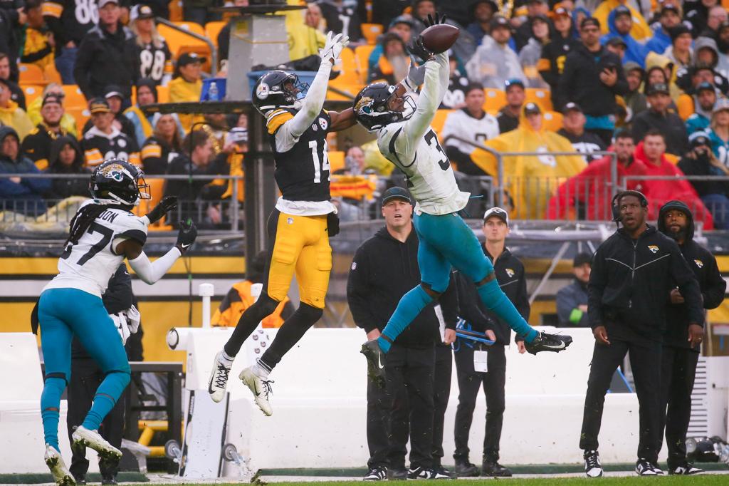 C.J. Beathard #3 of the Jacksonville Jaguars breaks up a pass intended for George Pickens #14 of the Pittsburgh Steelers during the fourth quarter at Acrisure Stadium on October 29, 2023 in Pittsburgh, Pennsylvania. 