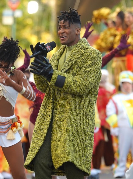 Jon Batiste performs at the Macy's Thanksgiving Day Parade route.