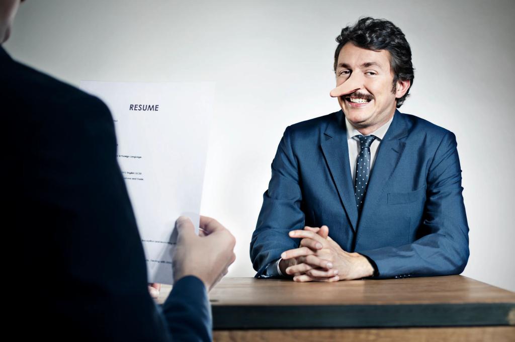 man in job interview with liar's nose