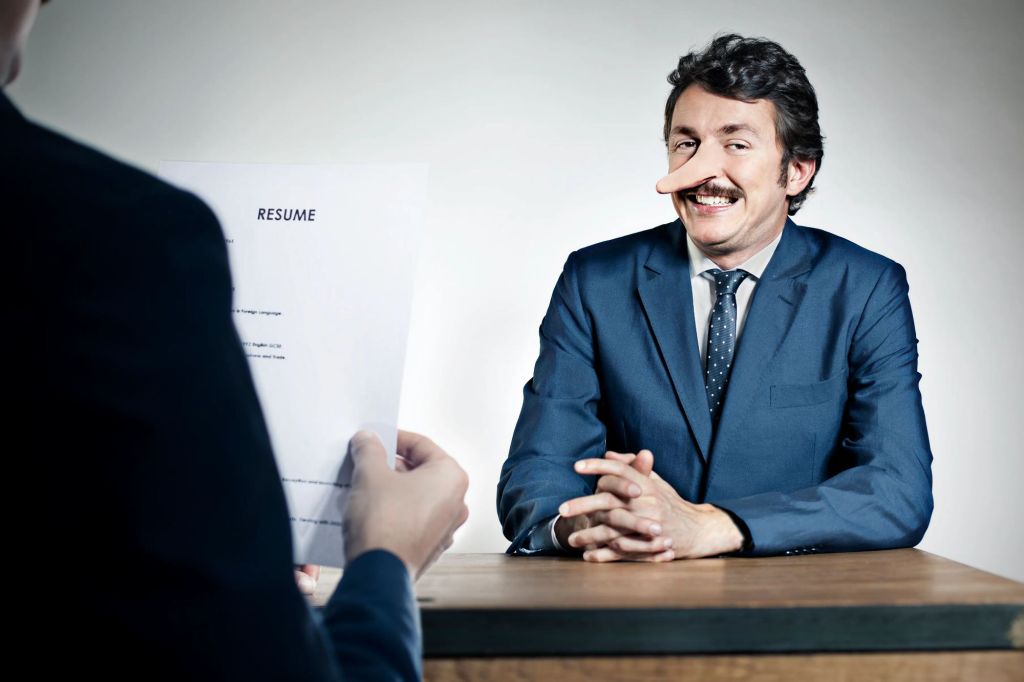 man in job interview with liar's nose